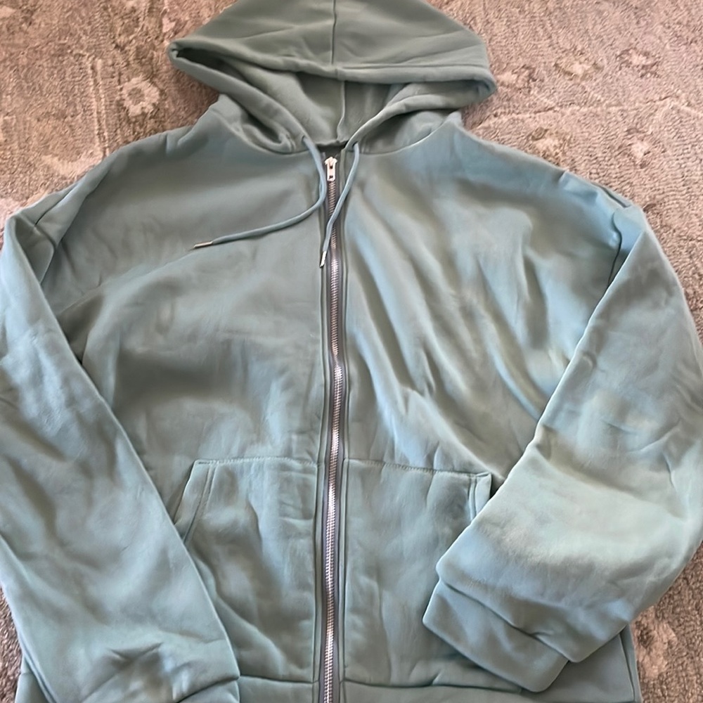 green zip up hoodie